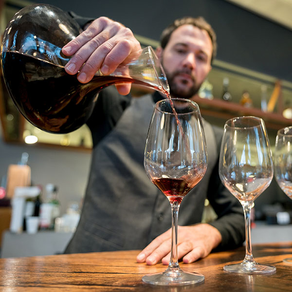 Pouring Wine from Carafe